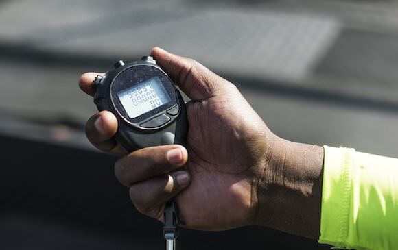 Holding stopwatch