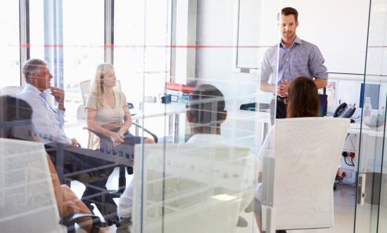 EOS Implementer facilitating a company's leadership team meeting