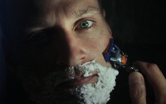 Man shaving beard 