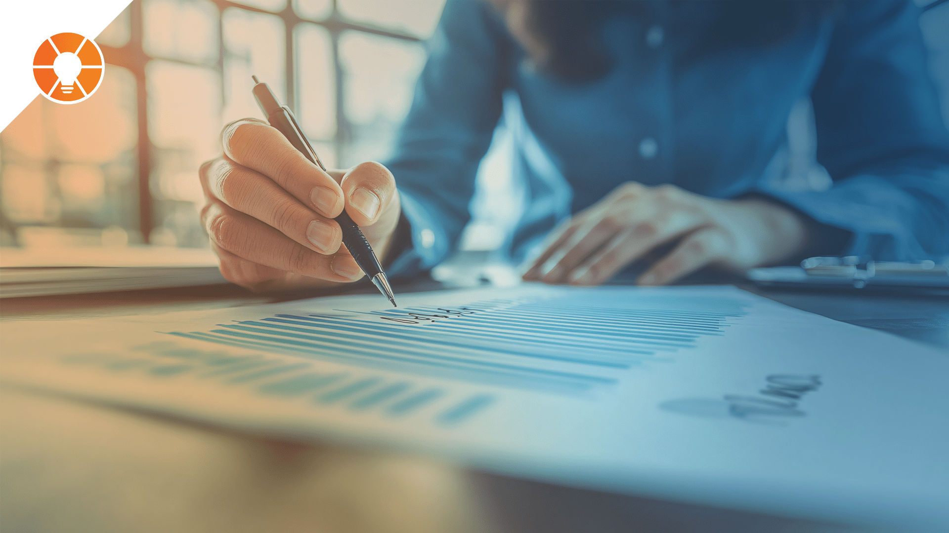 A person using a pen and paper to assess their workplace culture