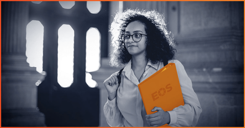 Bakck and white image of woman holding EOS Binder