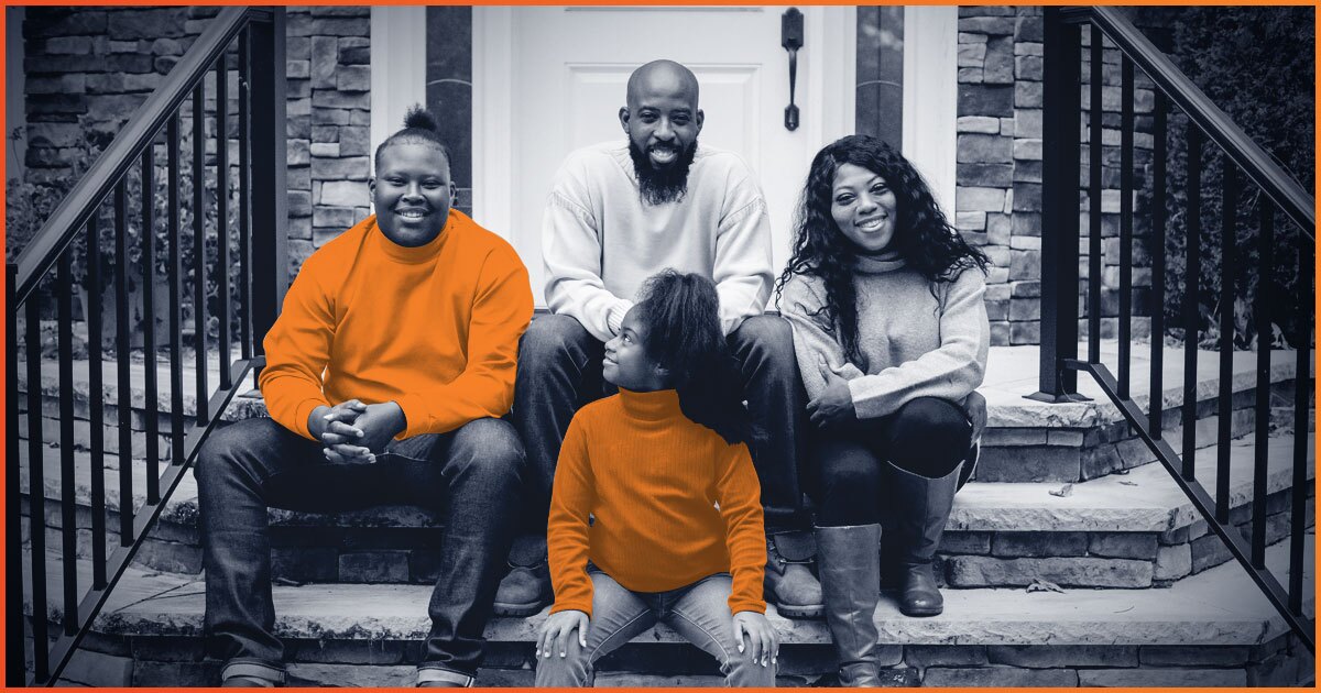 Family of 4 sitting on front steps