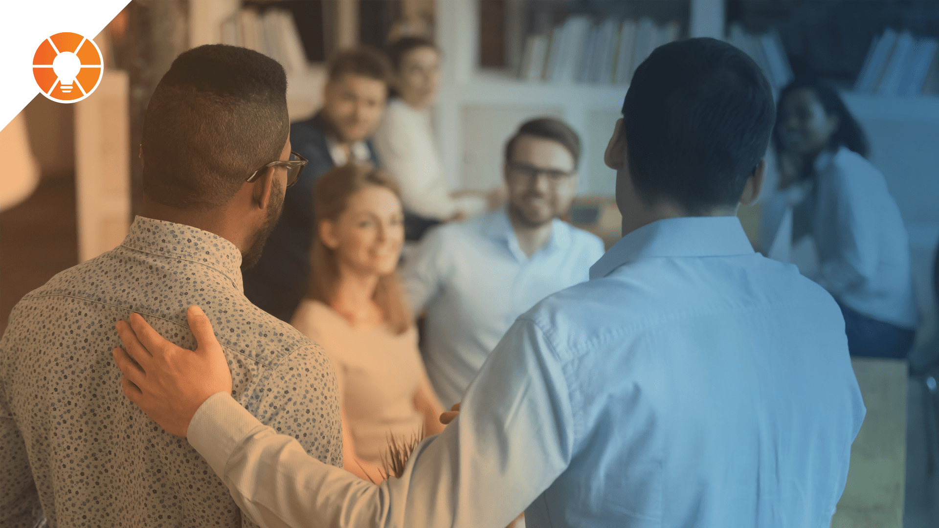 A person introduces a new hire to the rest of the team