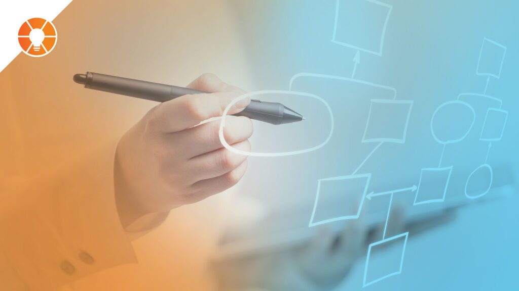 An entrepreneur holds a pen and draws diagrams for business process improvement