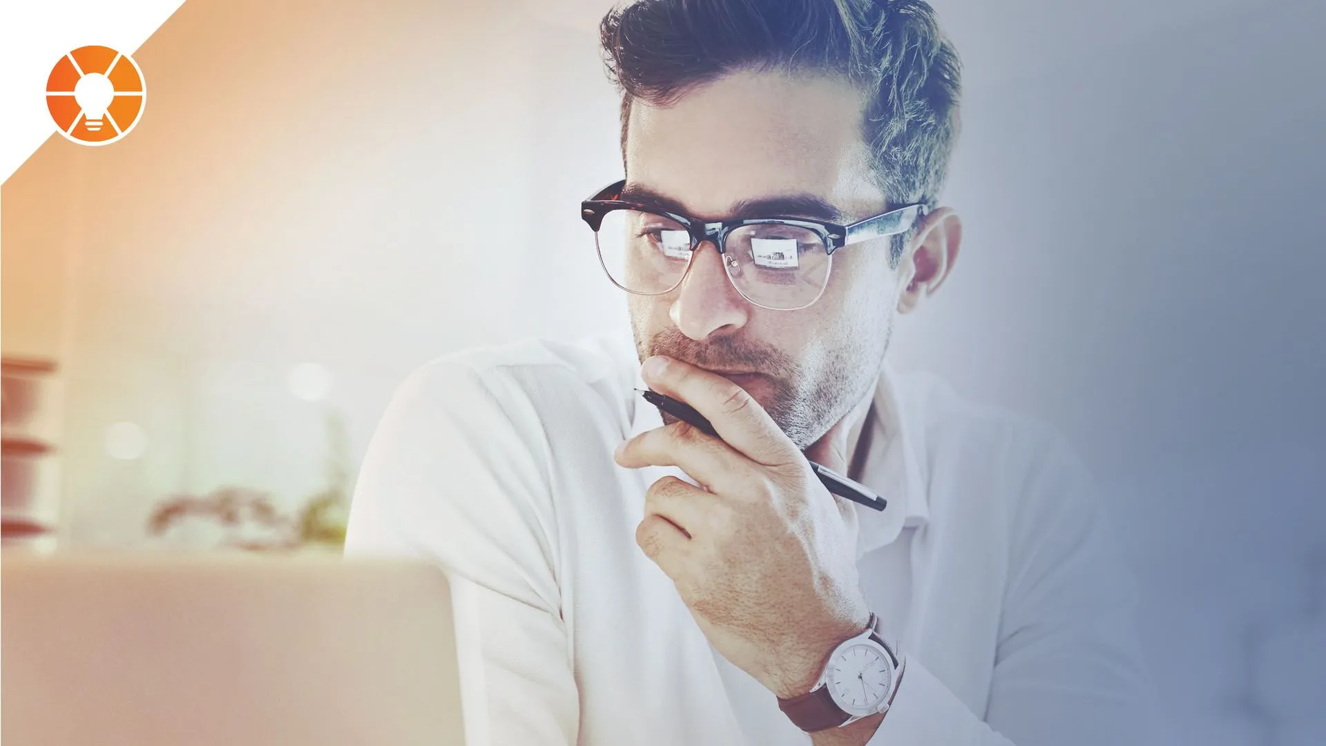 Person thoughtfully looking at a laptop
