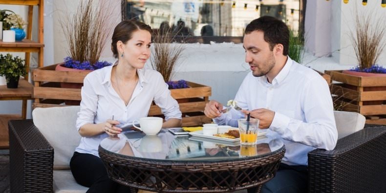 Two people eating breakfast