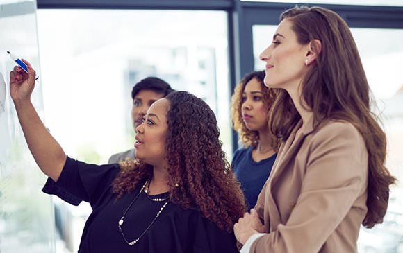 Group of women at whiteboard