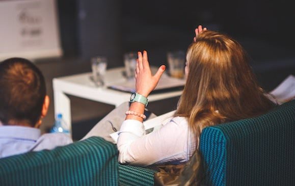 Woman in panel giving advice