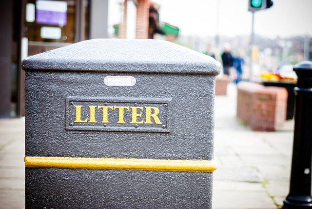 trash can on a downtown sidewalk | ditch your org chart!
