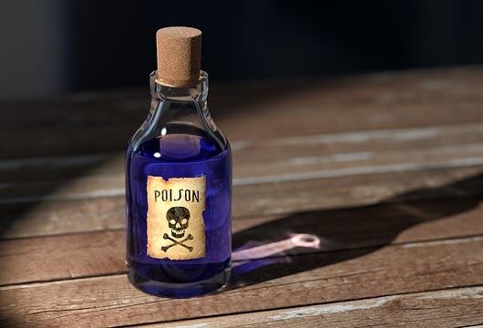 glass bottle of blue poison: toxic culture