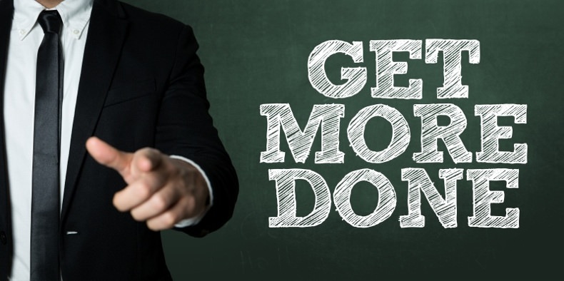 man in business suit pointing to camera with words that say "Get more done"