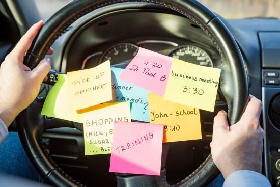 steering wheel with lots of sticky note reminders - what's the priority?