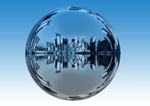 glass ball mirroring city skyscrapers | shiny object syndrome