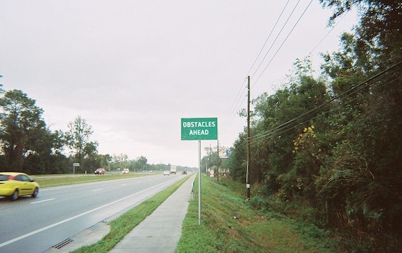 road sign reading Obstacles Ahead