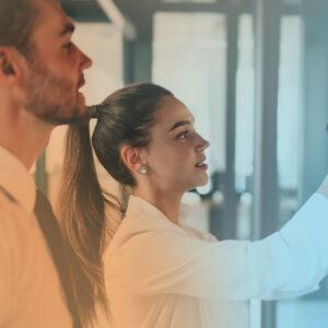 Two EOS leaders map a process on a whiteboard
