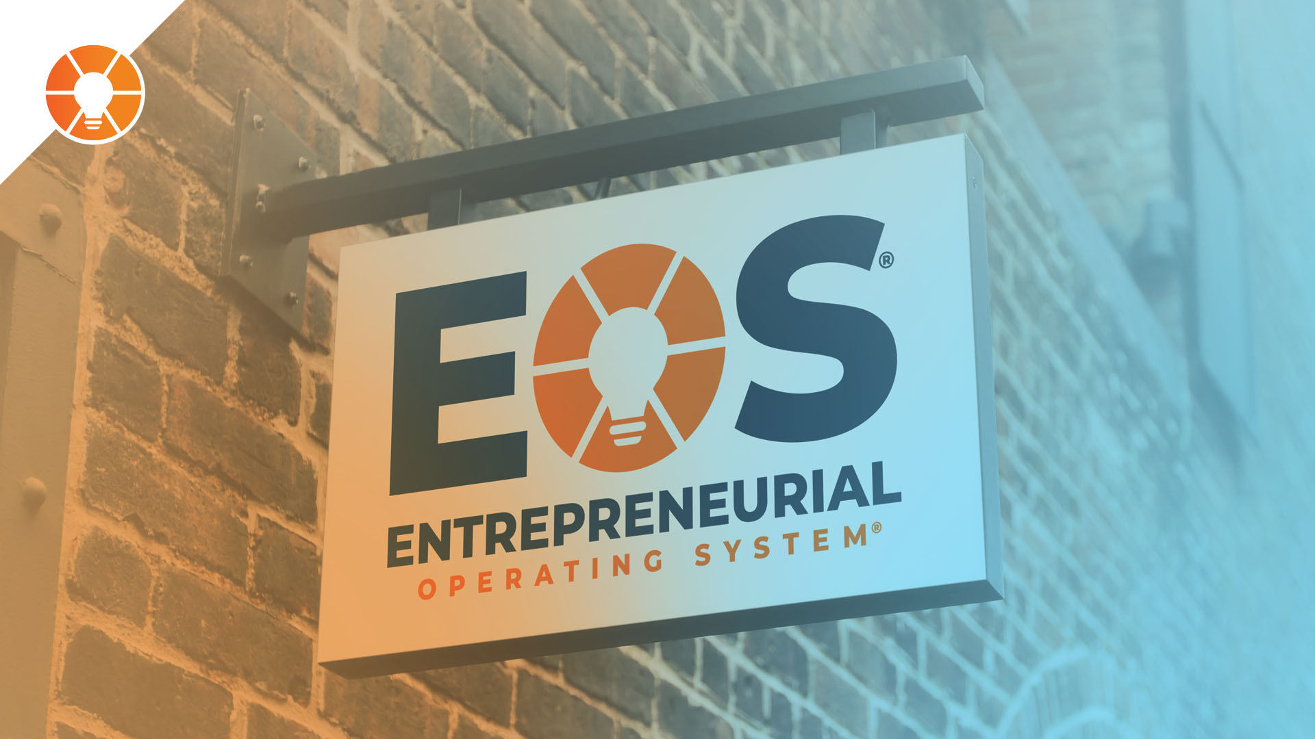EOS office sign on the side of a brick building