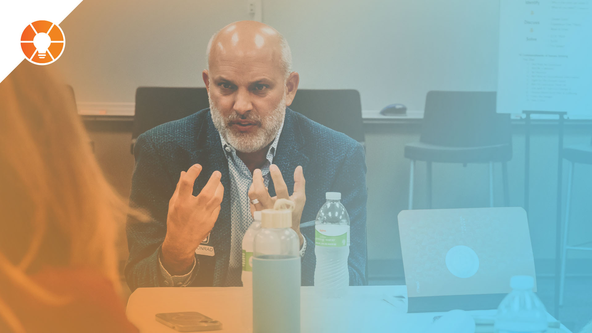 An EOS entrepreneur discusses Issues with their team in an L10 Meeting