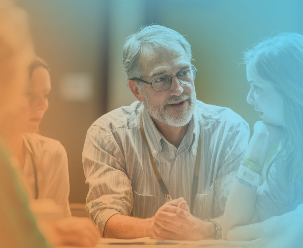 Business leaders discuss their business with an EOS implementer